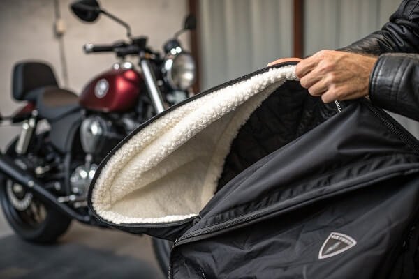 Innovative motorcycle cover materials A motorcycle cover with a soft, fleece-like inner lining being shown